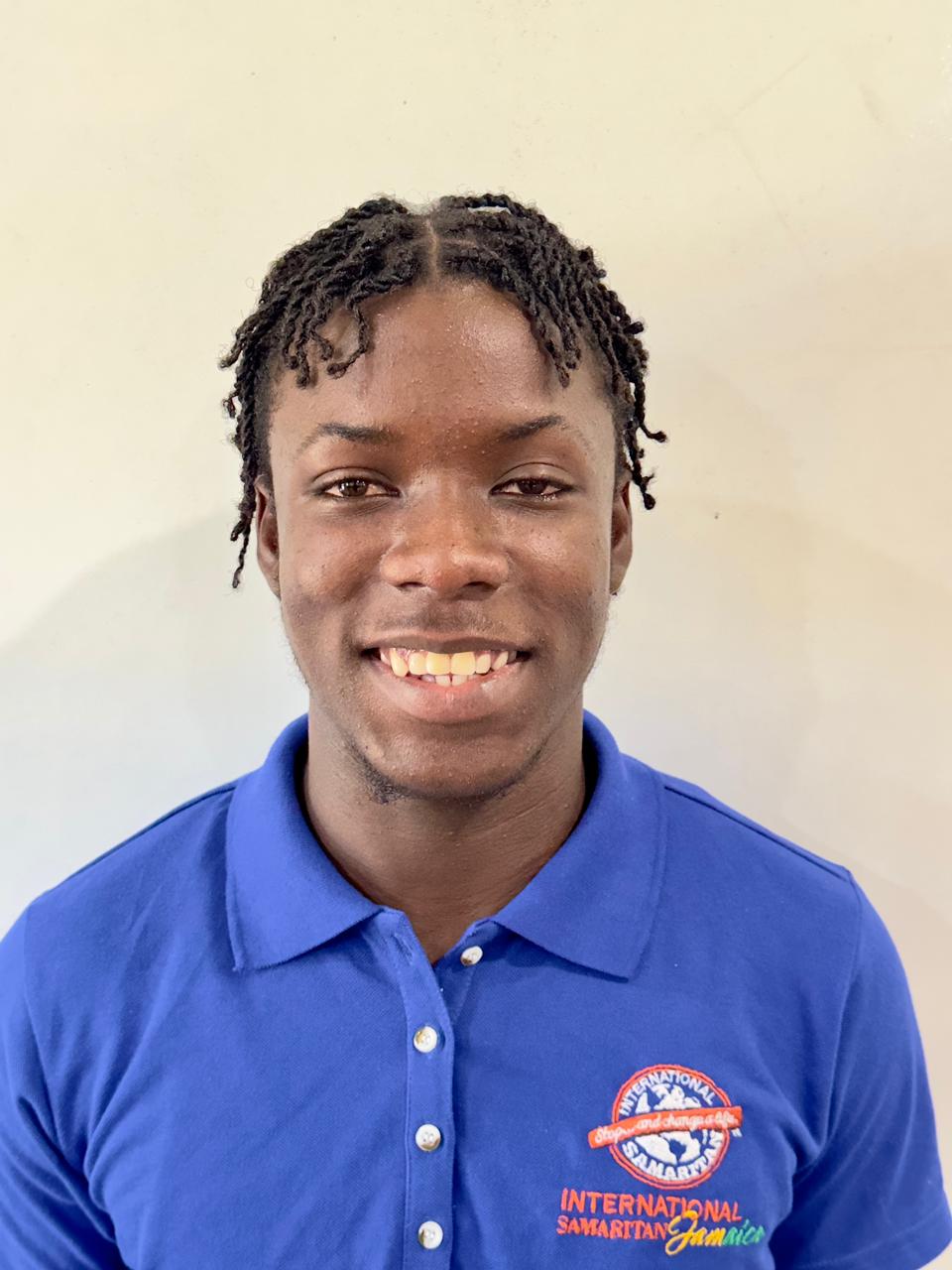 Akon, Samaritan Scholar, at a computer