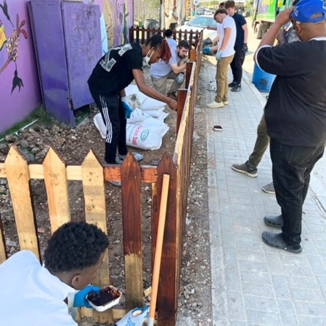Learn, Serve, Grow program students creating a community garden.